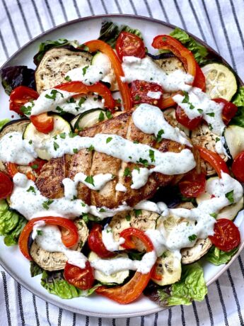 Grilled chicken and vegetables salad with garlic and mint dressing