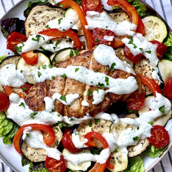 Grilled chicken and vegetables salad with garlic and mint dressing