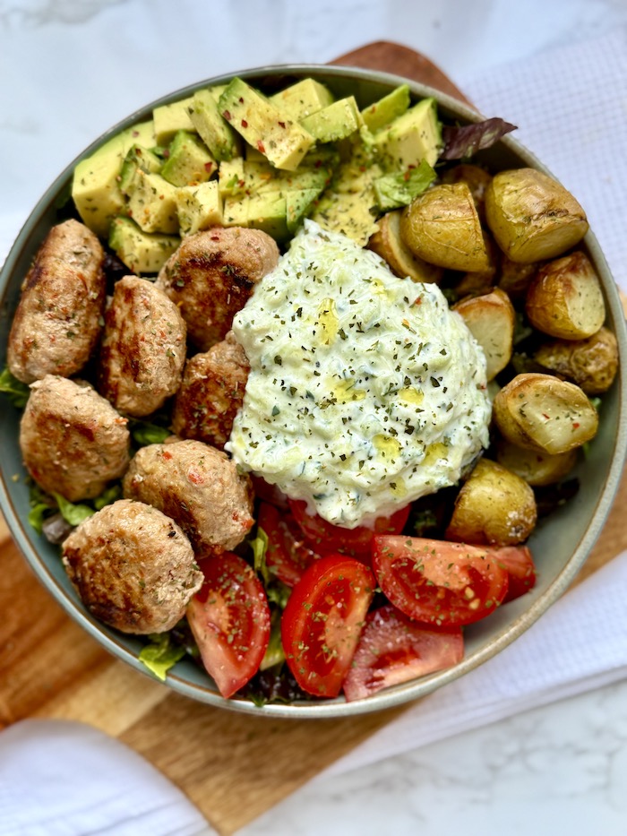 Chicken Meatball Bowl with Roasted Potatoes, Avocado, Tomatoes & Tzatziki Sauce